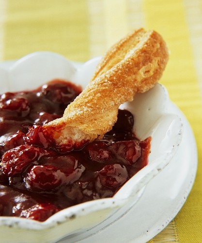 Morello cherry & sea buckthorn jam with a bread stick