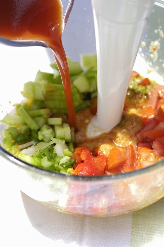 Mixing ingredients for pepper and tomato gazpacho