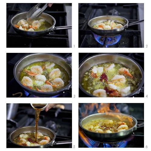 Prawns being fried and flambeed in a pan