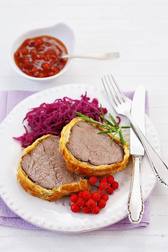 Beef Wellington with red cabbage salad and rowan berries