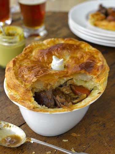Steak and ale pie with a puff pastry lid (England)
