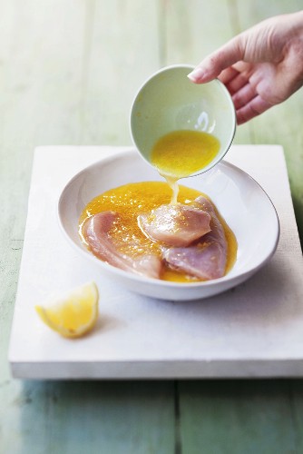 Chicken breast marinating in lemon marinade