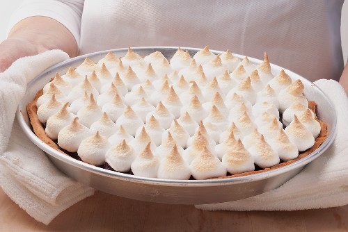 A fruit tart topped with meringue