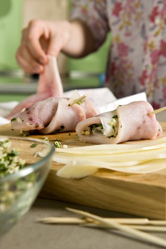 Involtini di pesce being made (fish rolls with a herb filling)