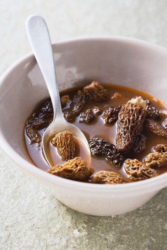 Dried morels being softened in light stock