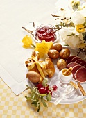Easter Breakfast with Ham and Rabbit-shaped loaf of Bread with Flower decoration