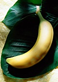 Whole Fresh Banana on a Banana Leaf