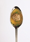 Liver dumpling soup in spoon