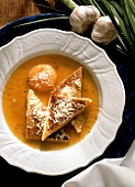 Zuppa pavese (broth with raw egg, Italy)