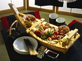 Japanese Appetizer Buffet in a Small Boat