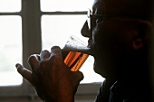 Man drinking a small Beer