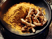 Turmeric Root and Ground Turmeric in Bowl
