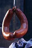 A Pair Lyon Sausages on a Hook