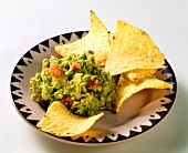 Tortilla Chips with Guacamole in a Bowl