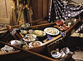 Fish buffet: boat; salads; salmon; baguette