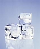 Three ice cubes; blue background