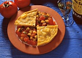 Tortilla with tomato and courgette sauce