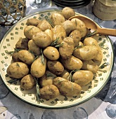 A Platter of Rosemary Potatoes on an Outdoor Buffet Table
