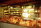 Cheese shop interior with many different cheeses