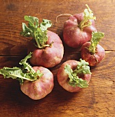 German white turnips (with delicate pink colour) on wood
