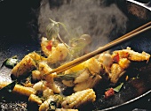 Squid with fresh chili, basil and sweetcorn in wok