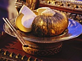 A Pumpkin Filled with Coconut; Sliced