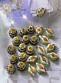 Pumpernickel Coins with Nut Mousse and Trout Mousse and Cucumber Slices with Salmon Mousse and garnished with Caviar