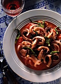 Octopus in wine with tomatoes, onions and fennel leaves
