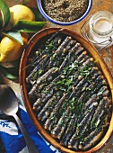 Oven-baked sardines with oregano, parsley and garlic