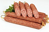 Several salamis and two halved salamis