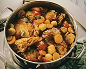 Braised rabbit pieces with vegetables in its own juice