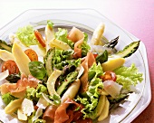 Salad with Lettuce, Cherry Tomatoes, green and white halved asparagus, Ham and Parmesan Dressing on Plate