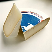 Two Wedges of Packaged Gouda Cheese