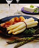 White asparagus with air-dried ham and a piece of butter