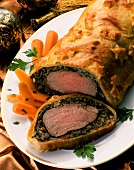 Beef fillet with mushroom and herb crust in puff pastry