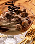 Apple and amaretto mousse in a glass dish garnished with amaretti