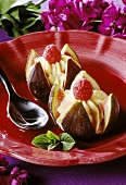 Fresh figs filled with mascarpone on raspberry sauce