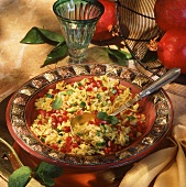 Saffron rice with pine nuts, courgettes & pomegranate seeds