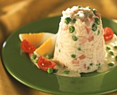 Turned-out rice and pea pudding with diced ham