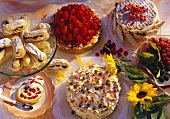 Various cakes, gateaux and small cakes with berries