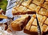 Engadiner nut torte on cake plate, pieces cut