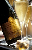Glass beside Veuve-Cliquot "Millennium Champagne"