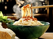 A Steaming Bowl of Spaghetti Being Served