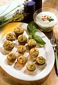 Stuffed mushroom caps with herb force meat on oval platter