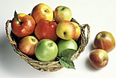 Assorted Types of Apples in a Basket