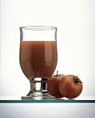 A Glass of Tomato Juice with Tomatoes
