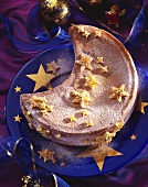 Half-moon shaped Christmas cake with marzipan stars