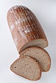 A Loaf of Wheat Bread with Two Slices