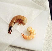 One Cooked and One Uncooked Shrimp