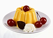 Vanilla pudding with whipped cream & cherries